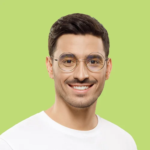 Confident male IT consultant smiling with glasses, representing expertise in digital solutions and technology services